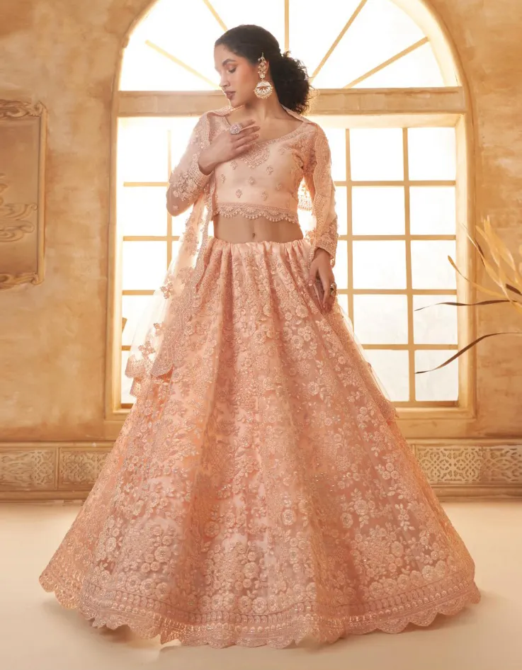 Peach Net Full Embroidered Wedding Wear Lehenga