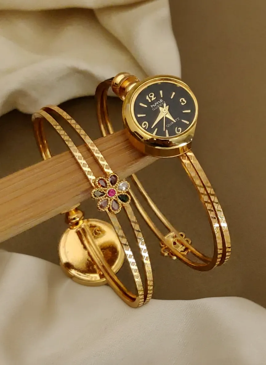 A Delicate Gold Bracelet Watch with Hand-Set Crystals